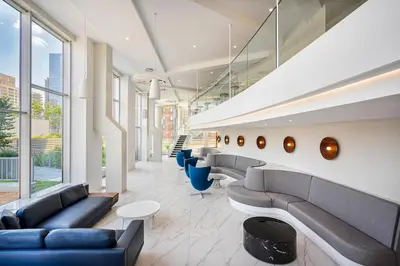 a lobby of a building with couches and chairs at UWS 1BR w WD nr Lincoln Center NYC-1187 in New York