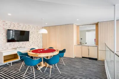 a dining room with a table and blue chairs at UWS 1BR w WD nr Lincoln Center NYC-1187 in New York