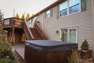 a house with a trampoline in front of it at Cozy House