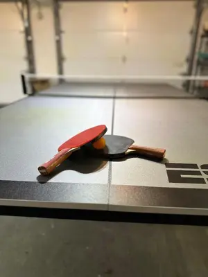 a knife and an orange sitting on a floor at Cozy House
