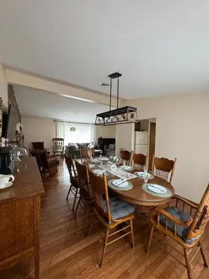 a dining room with a table and chairs at Cozy House