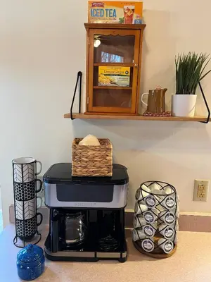 a coffee maker on a counter with a shelf at Forest View in Paradise