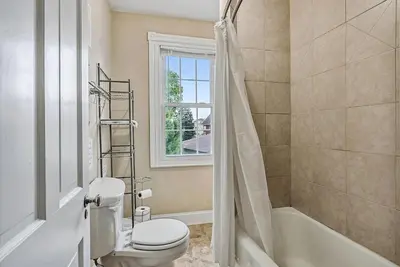 a bathroom with a toilet and a tub and a shower at NEW - Mainline Train, Colleges, Hospital in Bryn Mawr