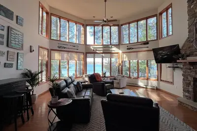 a large living room with a lot of windows at Beach and Dock! Group-Friendly Albrightsville Gem in Towamensing Trails