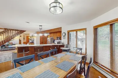 a dining room and kitchen with a table and chairs at Beach and Dock! Group-Friendly Albrightsville Gem in Towamensing Trails