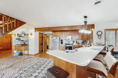 a kitchen with a large white island in a room at Beach and Dock! Group-Friendly Albrightsville Gem in Towamensing Trails