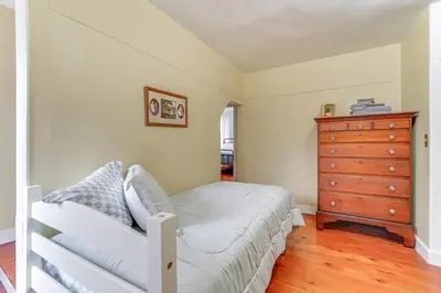 a bedroom with a bed and a dresser at 3 Mi to Penns Creek Access Hideaway with Grill! in Millmont