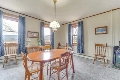 a dining room with a wooden table and chairs at 3 Mi to Penns Creek Access Hideaway with Grill! in Millmont