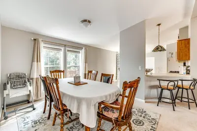a kitchen and dining room with a table and chairs at Family Home in Arrowhead Lake with Fire Pit! in Pocono Lake