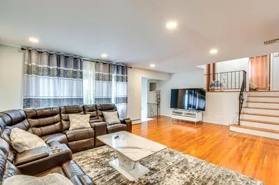 a living room with a couch and a tv at Work, Explore and Relax Centrally Located Union Gem in Union