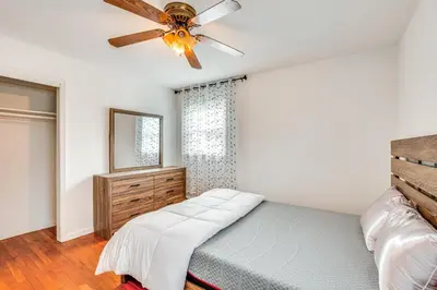 a bedroom with a bed and a ceiling fan at Work, Explore and Relax Centrally Located Union Gem in Union