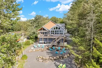 an aerial view of a house in the woods at Lakefront Sunset Horizon in Locust Lakes Village