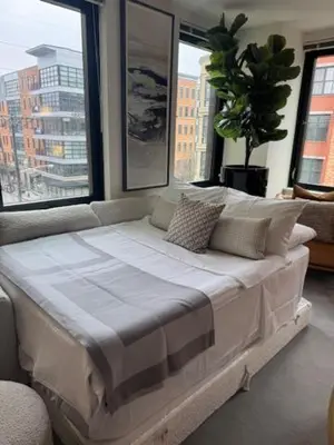 a large bed in a room with large windows at NEWLuxe 2bd2ba w Pool & More in Hoboken