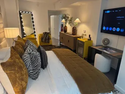 a bedroom with a large bed and a living room at NEWLuxe 2bd2ba w Pool & More in Hoboken
