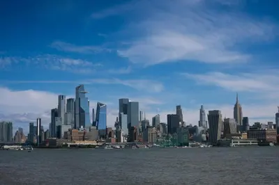 a view of a large city from the water at NEWLuxe 2bd2ba w Pool & More in Hoboken