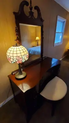 a desk with a lamp and a mirror in a bedroom at LARGE Open Floor Plan for Your Entertainment with a Short Walk to West Branch Delaware for Water fun and Fishing in Hancock
