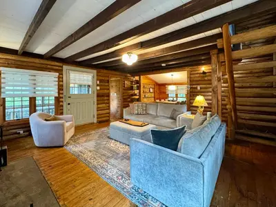 a living room with couches and chairs in a room at Lakefront Cabin with Hot Tub, Views & Fireplace in Lake Harmony