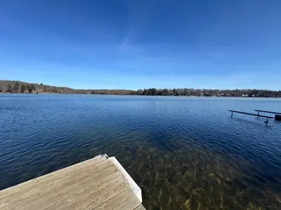 a dock on a large body of water at Lakefront Cabin with Hot Tub, Views & Fireplace in Lake Harmony