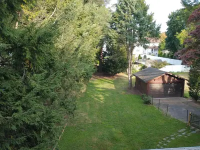 an aerial view of a yard with a shed at Comfortable 2 Bedroom House with Big Yard 30 Minutes to New York City in Ridgefield Park