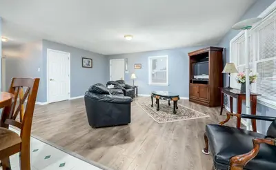 a living room with a couch and a table at Comfortable & Healthy Home in Parkesburg