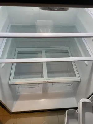 an empty refrigerator door is open in a kitchen at Comfortable & Healthy Home in Parkesburg