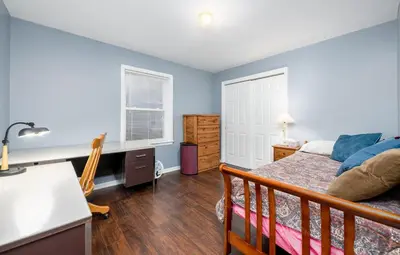 a bedroom with a bed and a desk at Comfortable & Healthy Home in Parkesburg