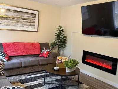a living room with a couch and a fire place at Spacious and tranquil 5br house in charming East Stroudsburg w game room, pets allowed in East Stroudsburg