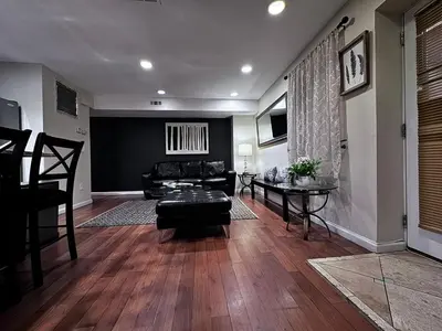 a living room with a couch and a table at Ultra Spacious Penthouse - Apt 2 - 3 Combo -15 Mins from NYC in Union City