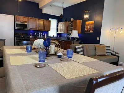 a kitchen with a table with blue dishes on it at Mega Trade Stunning View - APT 3-4 Combination in Union City
