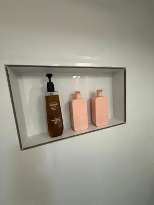 a shelf with two bottles of soap on it at Private Studio in Park House in Jenkintown