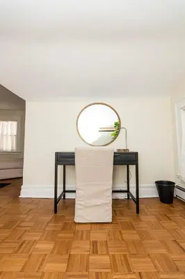 a table with a mirror on top of it at Spacious Beach Vibe Newark's Hidden Gem in Newark