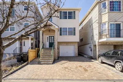 a house with a car parked in front of it at 3BR Stay for Crews & Families in Elizabeth