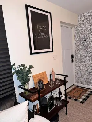 a living room with a table and a picture on the wall at 2BR Stay for Crews & Families in Elizabeth