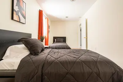 a bedroom with a bed with a comforter on it at 2BR Stay for Crews & Families in Elizabeth