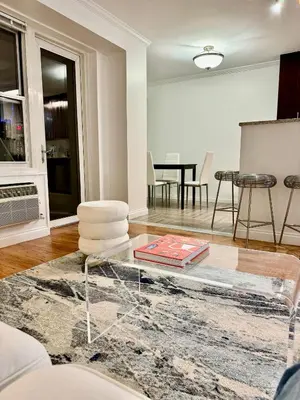a living room with a glass coffee table at Midtown High Floor Fantastic Panoramic City View Corner 2 Bedroom Apartment in New York