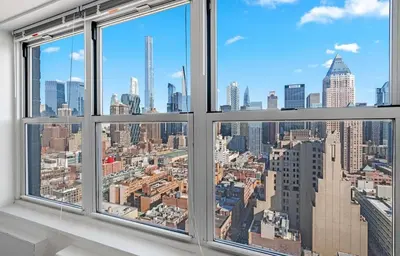 a view of the city from a window at Midtown High Floor Fantastic Panoramic City View Corner 2 Bedroom Apartment in New York