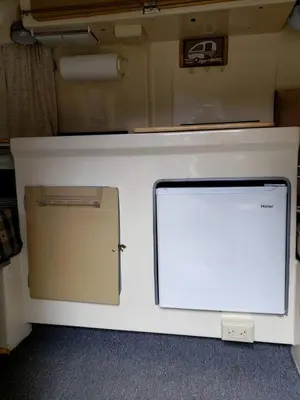 a white counter top with a computer on it at Unique Caravan for Vintage Glamping Experience in Pine Bush, New York in Pine Bush