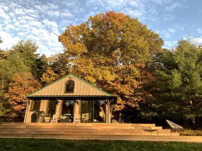 a gazebo in a park with trees in the background at Gorgeous Cottage for Two, Overlooking Pond on 20 acres, Glamping in Pennsylvania in Spring Mills