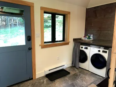 a laundry room with a washing machine and a window at Gorgeous Cottage for Two, Overlooking Pond on 20 acres, Glamping in Pennsylvania in Spring Mills