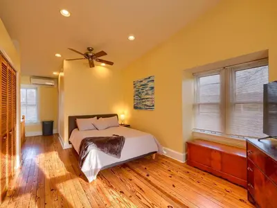a bedroom with a bed and a ceiling fan at Cozy Home in Historic Harrisburg in Harrisburg