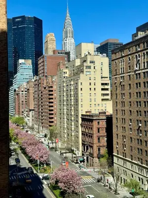 a view of a city with tall buildings at Midtown Park Ave Charming Chrysler View Corner Studio in New York