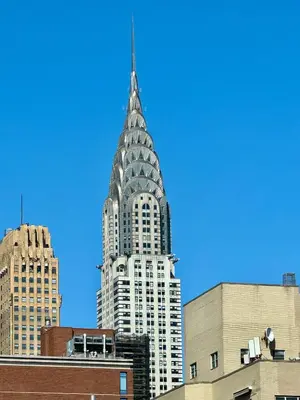 a tall building with a spire on top of it at Midtown Park Ave Charming Chrysler View Corner Studio in New York