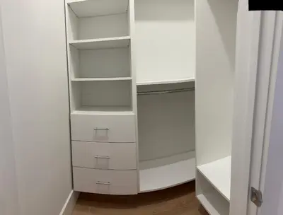 a white closet with white drawers and shelves at Modern 3BR,2BA Apartment in Jersey City, Easy Access to Manhattan in Jersey City