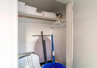 a closet with a cross on the wall and a mirror at Studio for 2! Heart of Midtown! in New York