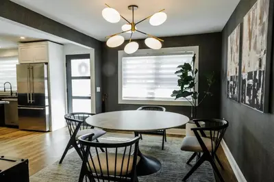 a dining room with a table and chairs at Luxurious Home Away from Home ! 30 minutes to NYC ! in Rochelle Park
