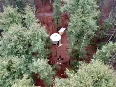 an overhead view of a white frisbee in the trees at Secluded in the Woods Cedar Hot Tub Pet Friendly in Mehoopany