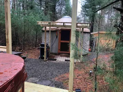 a small tent in the middle of the woods at Secluded in the Woods Cedar Hot Tub Pet Friendly in Mehoopany