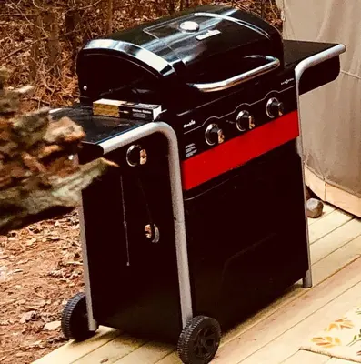 a toaster oven sitting on top of a cart at Secluded in the Woods Cedar Hot Tub Pet Friendly in Mehoopany