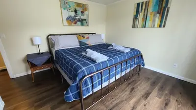 a bed with two pillows on it in a room at Riverfront Cottage in Owego in Owego
