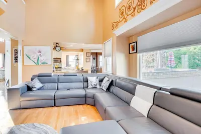 a large living room with a large couch at Theater and Game Room at Trenton Area Home in Edgewood Park